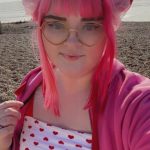 Pixie Parker smiling at camera on Worthing Beach